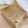 Wholesale 201 Stainless Steel Copper Flower Water Plating Vacuum Plating Zircon 18K Gold Plated 18K Gold Simple Style Coffee Bean Chain Transparent Gold Pendant Necklace