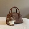 oly-491aef5a65d7aad50f9fc3edc291481e Wholesale Korean niche brown bowling ball handbag for women, autumn/winter style, high-end retro crossbody bag.