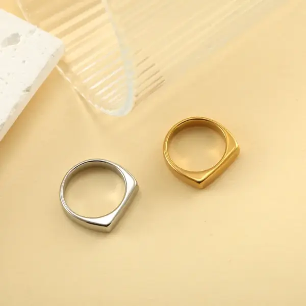 oly-49e80a0d9c95257d9dc0c9e70625848e Wholesale Unisex Rectangle Rings Crafted From Hypoallergenic 316 Stainless Steel With 18K Real Gold PVD Coating