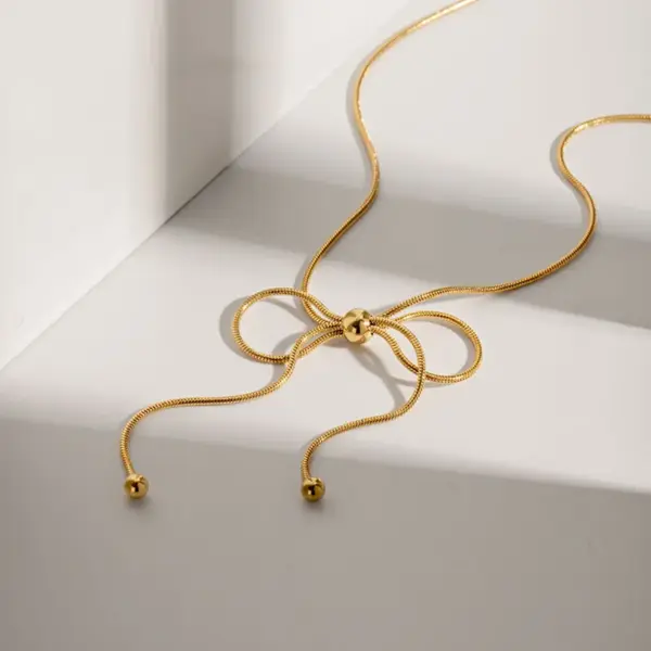 oly-49f18e35bc692db057e5f328d7cb9b19 Wholesale PVD Coated Real Gold Plated 18K Gold Bow Knot 304 Stainless Steel Simple Style Waterproof Non Tarnish 304 Stainless Steel Pendant Necklace