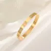 Wholesale PVD Coated Real Gold Plated 18K Gold Cross Heart Shape Flower 304 Stainless Steel Elegant Waterproof Non Tarnish 304 Stainless Steel Bangle