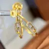 Wholesale C Shape Earrings For Women Featuring Bezel Setting Zircon Inlay Made Of Brass With 18K Real Gold Plated Finish