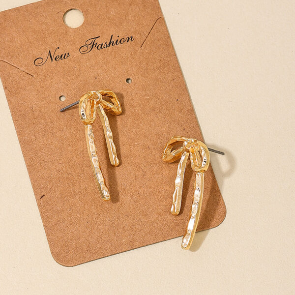 Wholesale 1 Pair Ig Metal Style Simple Spring and Summer Earrings Hollow Bow Women Commuter Earrings Earrings Stud