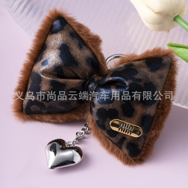 oly-50f4d138585d432f3c55f85915083899 Wholesale Ins Accessible Luxury Leopard Print Leather Cotton-Filled Bow Heart Keychain Niche Design Sexy Sweet and Cool Mobile Phone Chain
