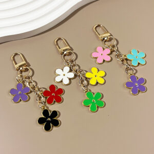 oly-531dd1048fb32b001339457dee2702aa Wholesale double-sided drip oil color flower alloy keychain creative Airpods bag pendant