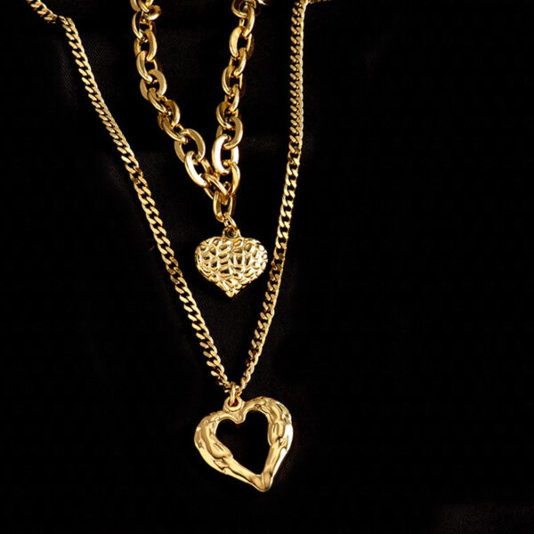 oly-58ec115d3889535f62e63e40d5764773 Wholesale retro fashion high-end simple multi-layer titanium steel metal chain texture hollow heart pendant necklace
