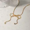 oly-5a56e60f49e21077783958eb6f20a813 Wholesale PVD Coated Real Gold Plated 18K Gold Bow Knot 304 Stainless Steel Simple Style Waterproof Non Tarnish 304 Stainless Steel Pendant Necklace