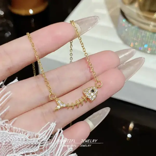 Wholesale Fish Bone Pendant Necklace For Women With Inlay Artificial Rhinestones, 18K Real Gold Plated Copper And Water Plating On Cable Chain