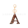 oly-5ff1f1ce537a0e1b9f709ee26d75ab96 Wholesale Acrylic leopard print letter keychain 26 letters complete creative fashion jewelry transparent pendant gift
