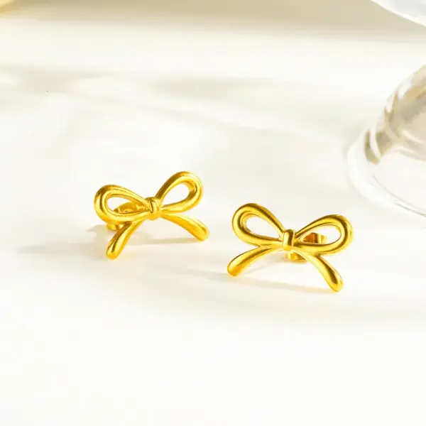 Wholesale Asymmetrical Bow Tie Stud Earrings For Women In 304 Stainless Steel With 18K Real Gold PVD Coated Plating And 0.03µm Thickness