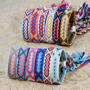 oly-60fcbf43d0246d4a6e734241ad70f7fe Wholesale Nepal ethnic style hand-woven bracelet women's colorful tassel lucky friendship hand rope jewelry
