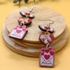 oly-627d9cc6613953fadfd4c6f39c042447 Wholesale Romantic Valentine's Day Earrings Pink Love Rose LOVE Cupid Bear Simple Distinctive Earrings