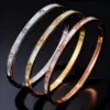Wholesale Waterproof Non Tarnish Titanium Steel Shell Bangle With Zircon Inlay, Real Gold Plated For Women In Steel Color