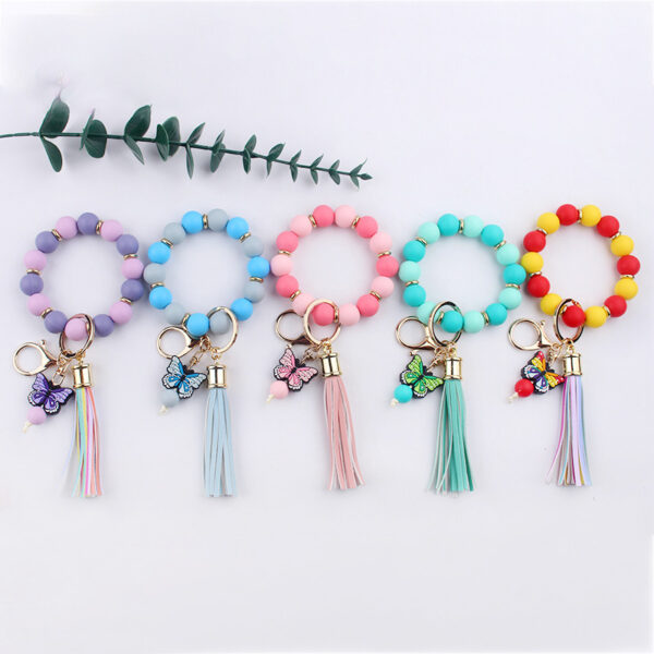 oly-66bdec725004220b4160984ef97b978a Wholesale Creative DIY Beaded Cartoon Butterfly Wrist Keychain Pendant Rainbow Leather PU Tassel Ring Key Ring Accessories