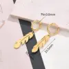 Wholesale Best Seller In 304 Stainless Steel Water Plating Furnace Vacuum Plating Light Gold Snowflake Cat Heart Key Feather Pineapple Small Size Hollow Face Earrings Earrings