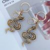 oly-6b9a4ee22cd81b011037494afa6dd7cb Wholesale Zodiac Diamond-embedded gradient snake keychain car bag pendant creative gifts for the year of birth