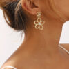 Wholesale E12859 metal-style geometric diamond earrings fresh and sweet hollow flowers light luxury exquisite earrings for women