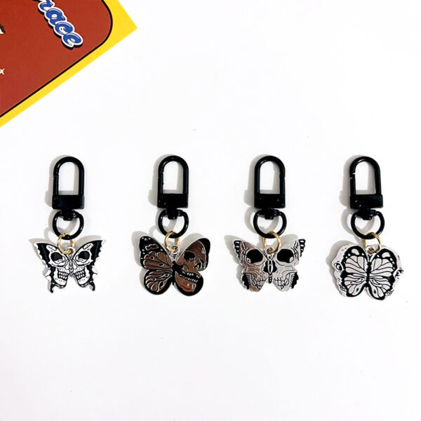 oly-6ec3bc542bada8332c8ef2952921573d Wholesale game series trendy skull butterfly keychain Halloween vintage pendant cold style all-match OLY Exclusive