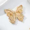 Wholesale Butterfly Pin In Red Zinc Alloy Featuring Diamond Craft, Perfect For Independence Day