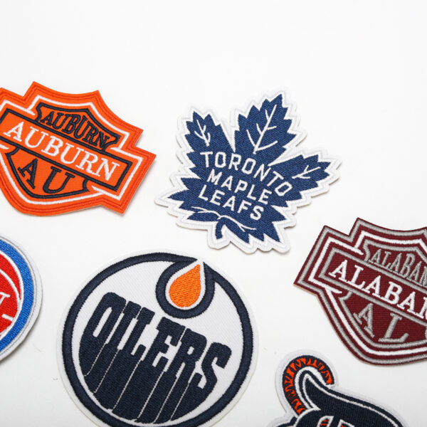 oly-719212609a1a1b88b90c020b954b5108 Wholesale embroidered basketball team computer embroidered stickers clothing bag decorative stickers shoes and hats patch maple leaf letter stickers