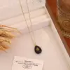 Wholesale Bohemian Water Droplets Pendant Necklace For Women With Gold Stone Texture And Rhinestone Inlay On Cable Chain