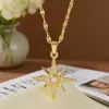 Wholesale Starburst Inlay Pendant Necklace For Women, 18K Gold Plated Copper With Artificial Rhinestones And Lip Chain