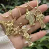 Wholesale Waterproof Non Tarnish Skull Pendant Necklace For Women In 18K Gold Plated Copper With Zircon Inlay And Snake Chain
