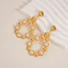 Wholesale Imitation Gold Plated 304 Stainless Steel Water Plated Artificial Gemstone Water Drop Hollow Vacuum Electroplated Waterproof Non-Fading Earrings For Women