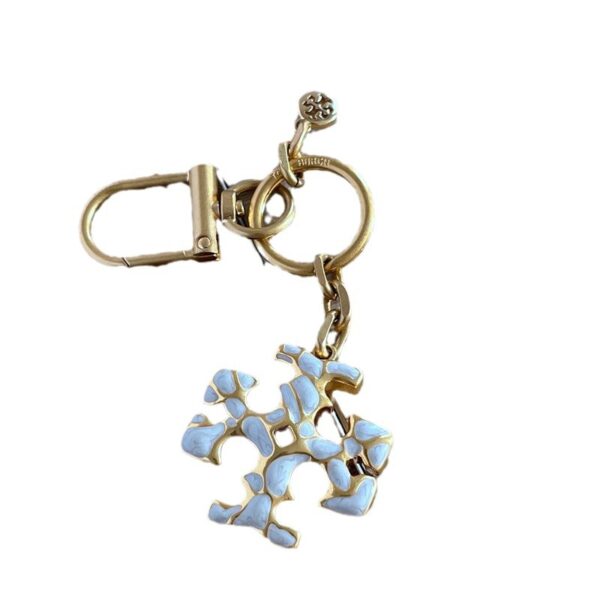 oly-7daa22369b559391f60c46340c1709e6 Wholesale fashion · simple commuter niche design enamel glaze hand painted English letters metal keychain