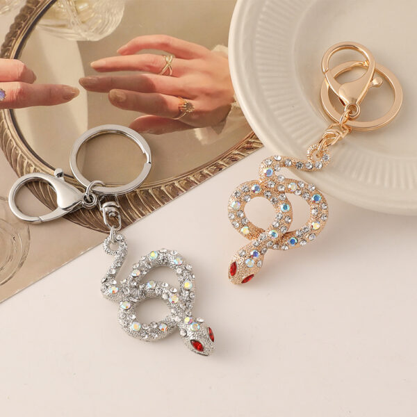 oly-820b89ca1681ed91dca5aac70bcc8112 Wholesale Zodiac snake car keychain diamond exquisite bag pendant this life year snake series small gift