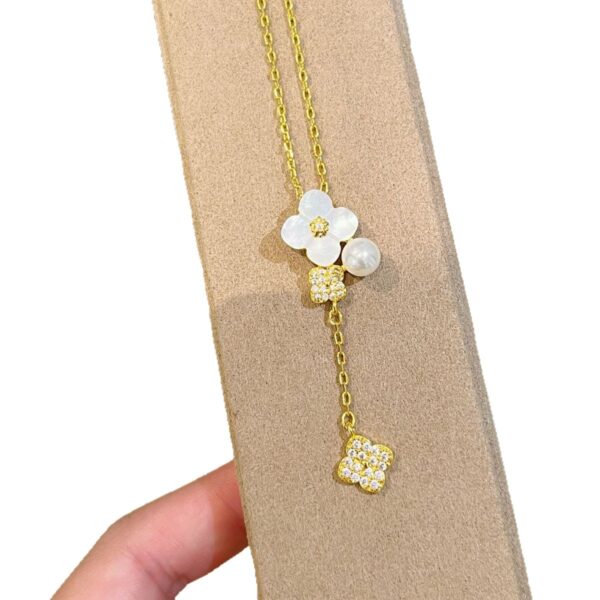 Wholesale Copper vintage four-leaf clover white shell tassel necklace, five-flower bracelet, earrings
