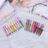 oly-83d40e6b2a70fc0b0523081027a95c4f Wholesale DIY sequins beaded pen wholesale five-pointed star sequins creative cute beaded ballpoint pen stickers diamond cute pen
