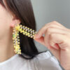Wholesale South Korea East Gate Laser Sequin Flower Tassel Earrings Vacation Style Eye-catching Bright Eye Strap Long Dress All-match Earrings
