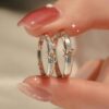 oly-87bc209a6153b8f150bf511daa1baa9e Wholesale Sterling Silver Eternal Heart Knot Couple Ring Valentine's Day Ring for Men and Women Simple Exquisite Unique Color-separation Adjustable