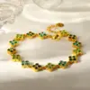Wholesale Flowers Bracelet For Women In 304 Stainless Steel With 18K Real Gold Plated Coating 0.03µm Featuring Zircon And Handmade Chain