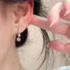 Wholesale Electroplated Brass Earrings For Women Featuring Silver Plated Finish And Pearl Inlay With Elegant Flower Design