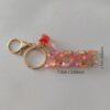 Wholesale Resin flash years digital creative accessories popular love hanging sequins mixed color keychain