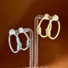 Wholesale C Shape Earrings For Women Featuring Bezel Setting Zircon Inlay Made Of Brass With 18K Real Gold Plated Finish
