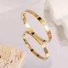 Wholesale PVD Coated Real Gold Plated 18K Gold Cross Heart Shape Flower 304 Stainless Steel Elegant Waterproof Non Tarnish 304 Stainless Steel Bangle