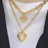 oly-8dec243685890817f337cce68040dcf7 Wholesale retro fashion high-end simple multi-layer titanium steel metal chain texture hollow heart pendant necklace