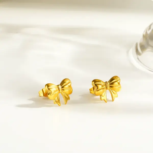 Wholesale Asymmetrical Bow Tie Stud Earrings For Women In 304 Stainless Steel With 18K Real Gold PVD Coated Plating And 0.03µm Thickness