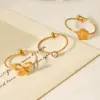Wholesale 304 Stainless Steel Flower Bow Knot PVD Coated Zircon 18K Gold 18K Real Gold Plated IG Style Simple Style Waterproof Non Tarnish Inlay Gold Open Rings