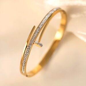 Gold nail bracelet with diamonds