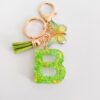 Wholesale 26 English Alphabet Keychain Pendant Green Star Glitter Resin Pendant Personality Key Chain