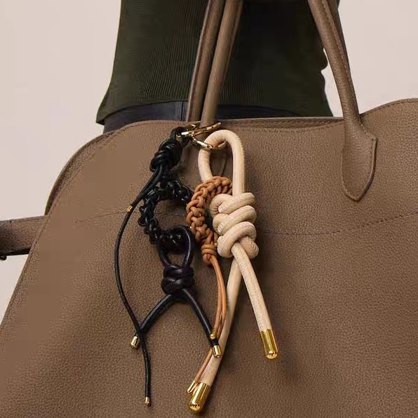 oly-984cbce73c767703ba75034497ab50cb Wholesale selling high-end all-match jewelry pendant trend woven bag mobile phone case key chain pendant