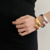 oly-9992fb99fc625257ff99dd2b1c17bbc0 Wholesale metal style geometric smooth cross retro ins bracelet women's light luxury niche high-end exquisite bracelet