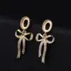 Wholesale Bow Tie Stud Earrings With 925 Sterling Silver Posts, Copper Base Electroplated With 14K Real Gold, Featuring Zircon Inlay