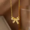 Wholesale Women’s Bow Tie Pendant Necklace With Inlay Artificial Rhinestones, 18K Real Gold Plated Copper, Water Plating On Cable Chain