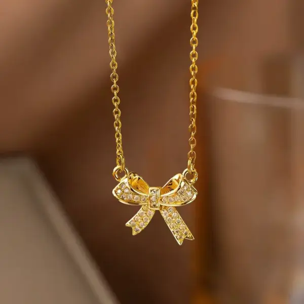 Wholesale Women’s Bow Tie Pendant Necklace With Inlay Artificial Rhinestones, 18K Real Gold Plated Copper, Water Plating On Cable Chain