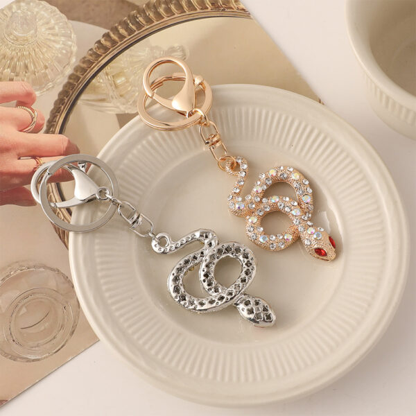 oly-9c518f86498b5fe643733abec2647dca Wholesale Zodiac snake car keychain diamond exquisite bag pendant this life year snake series small gift